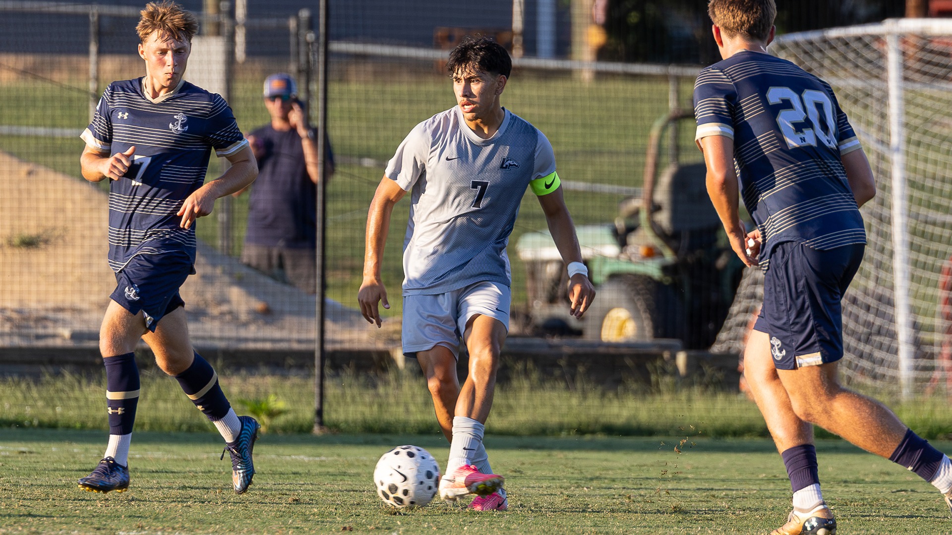 Ezrah Serralde passes the ball in the midfield with the Sunday shining in the first half vs. Navy. 
