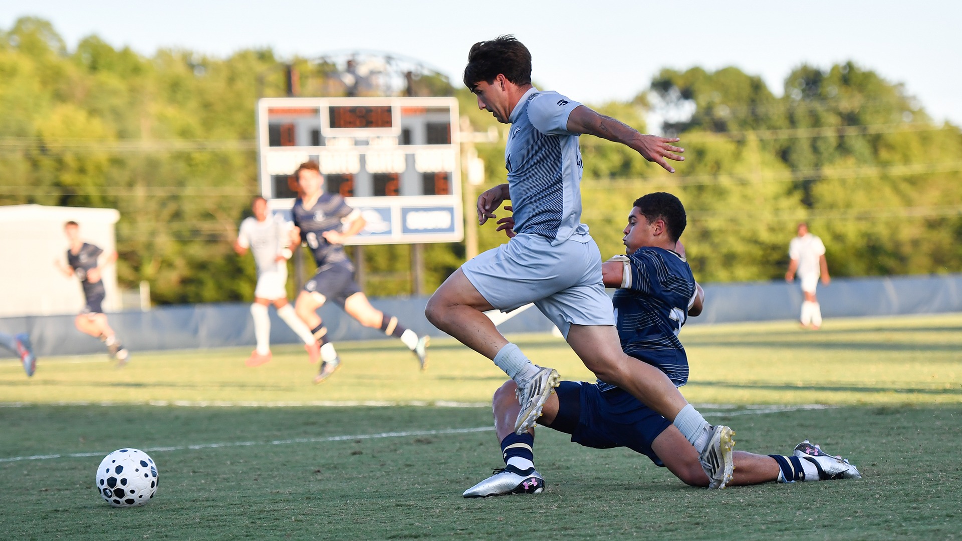 Vicent Martinez gets tackled after dribbling around a Navy defender in Longwood's home game at the Longwood Athletics Complex vs. the Midshipmen on Sept. 15, 2026. 