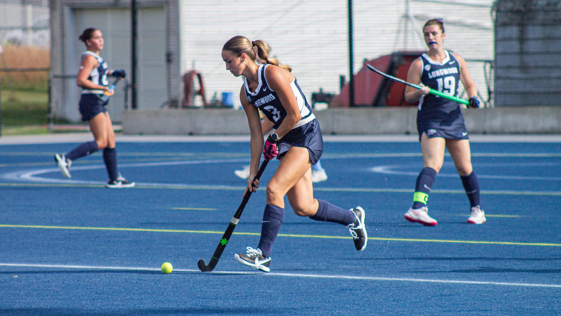 Hailey Flick carries the ball across the field 
