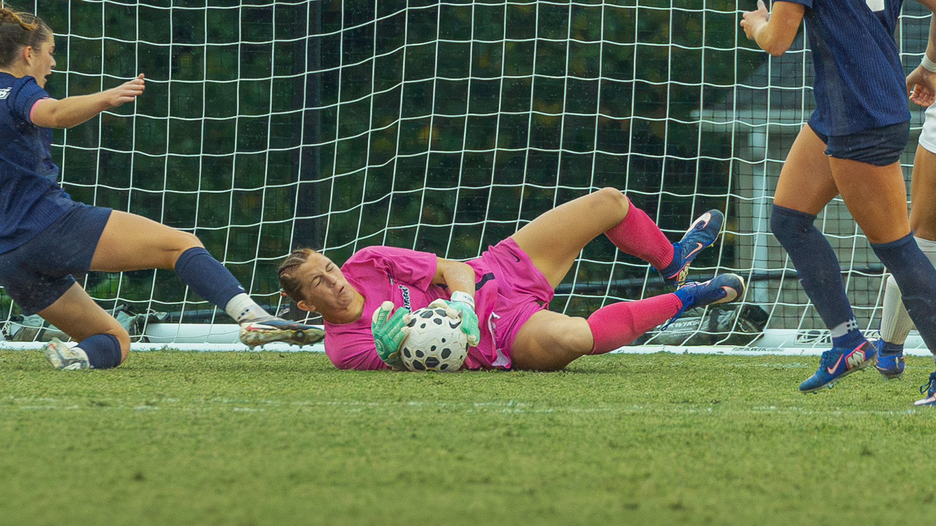 Brynn Clagett males a save against Charleston Southern