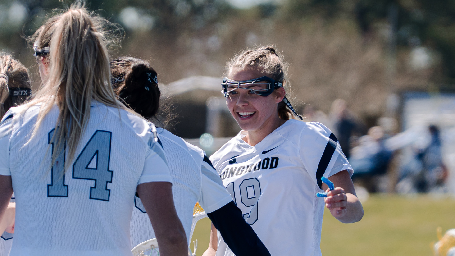 Mikaela Cook smiles after a goal for Longwood
