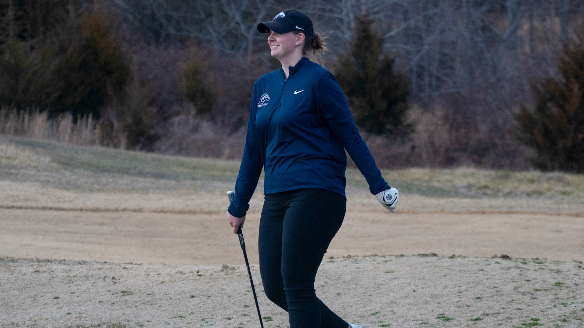 Madison Lehr smiles after a golf shot
