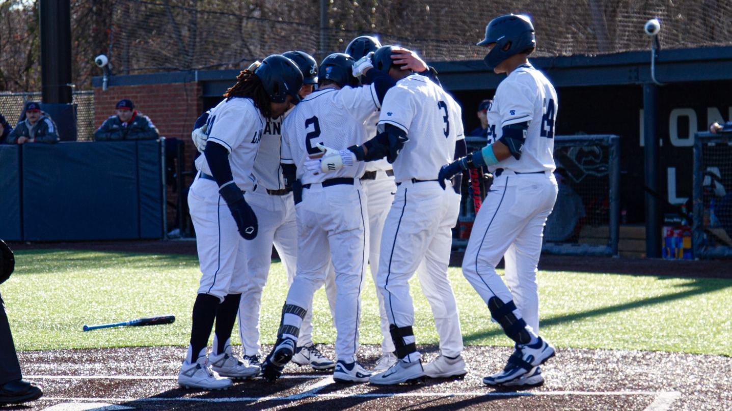 Baseball at home plate after grand slam from Brogan Jones