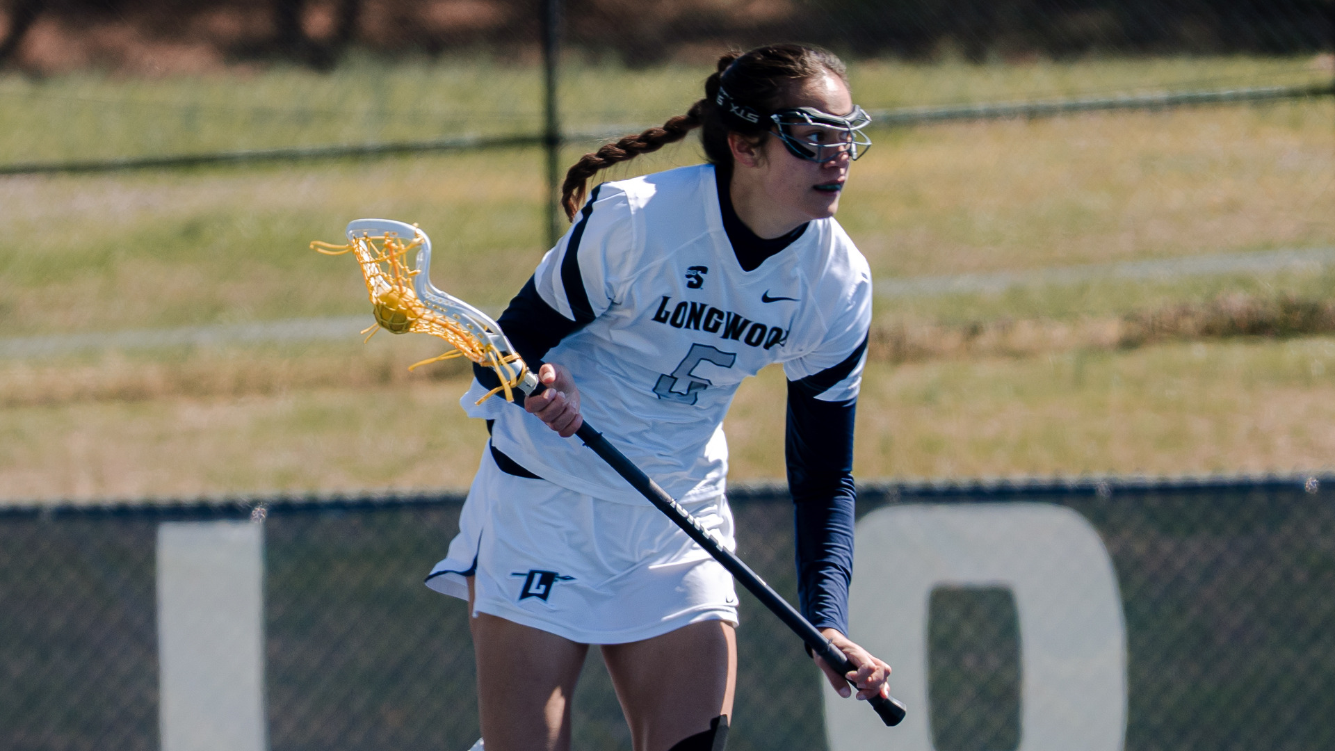 Kendra DeFilippo carries the ball for lacrosse