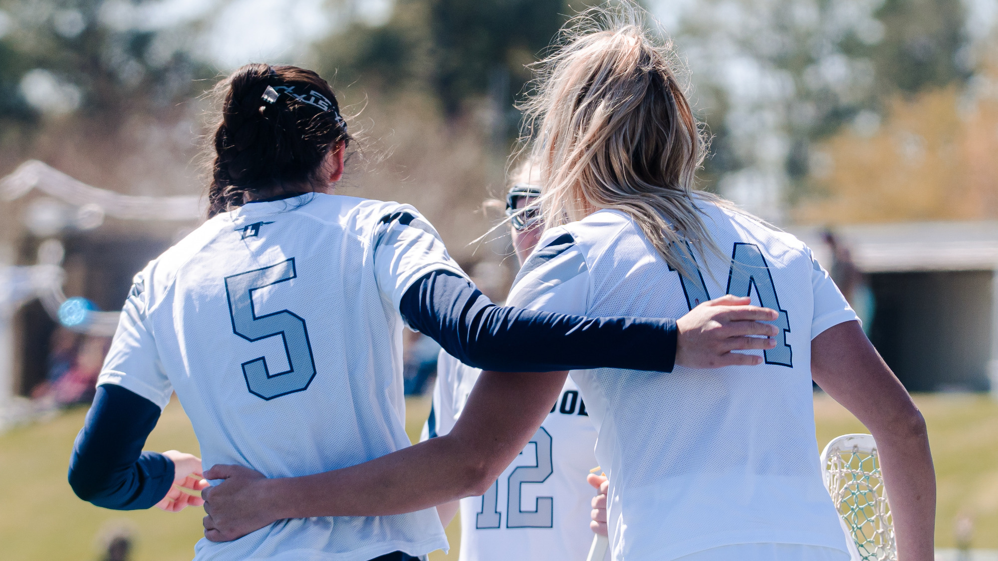 Kendra DeFilippo, Madison Rogers walk toward their teammates