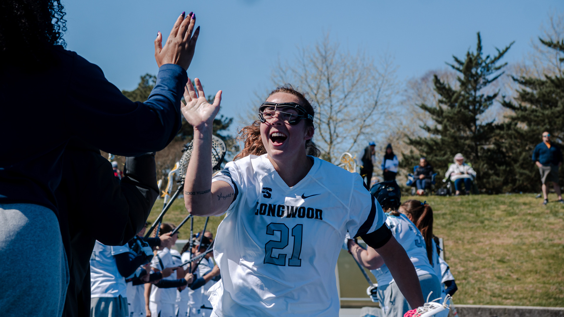 Lily Stohlman runs through the starting line for lacrosse