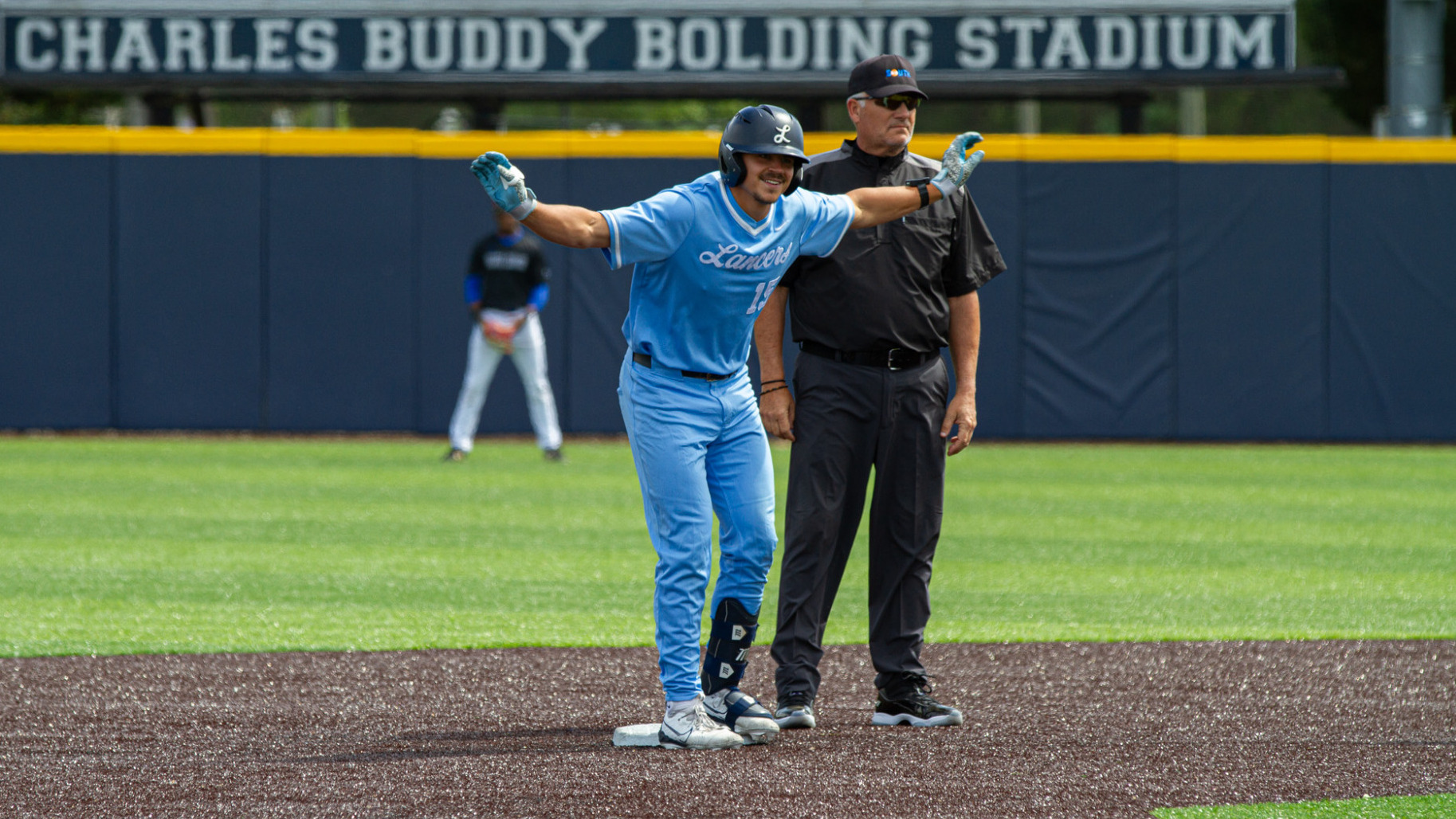 Lucas Johnson celebrates getting to second base