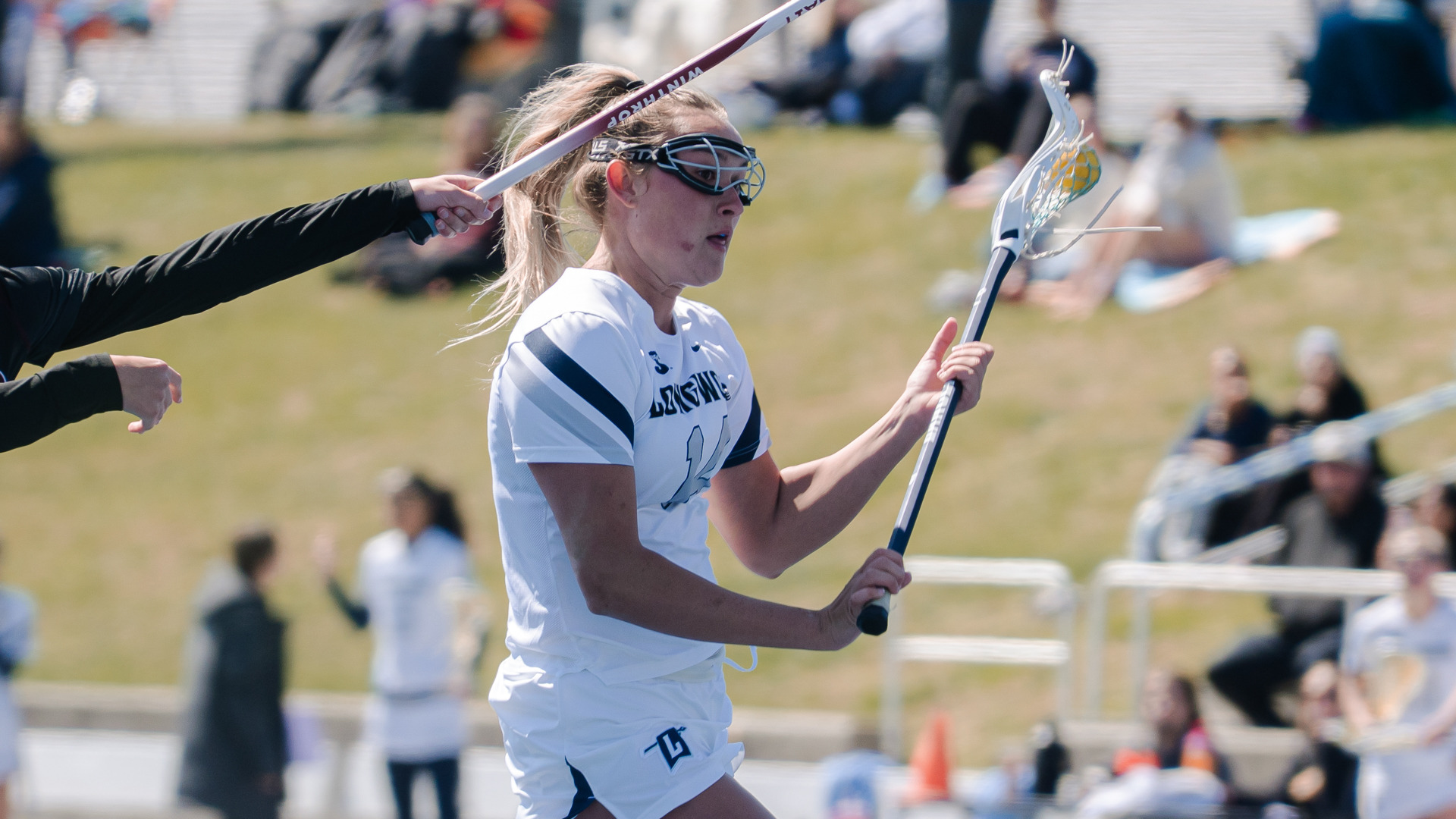 Madison Rogers drives toward the goal