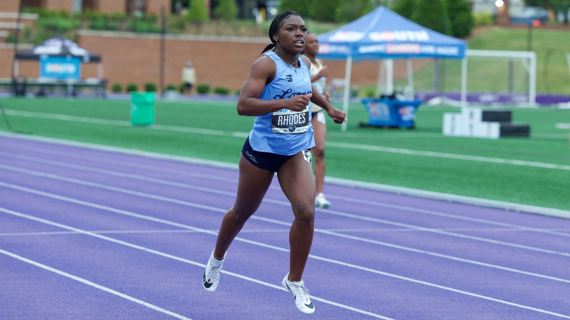 Nyomi Rhodes runs in the women's 400-meter hurdles