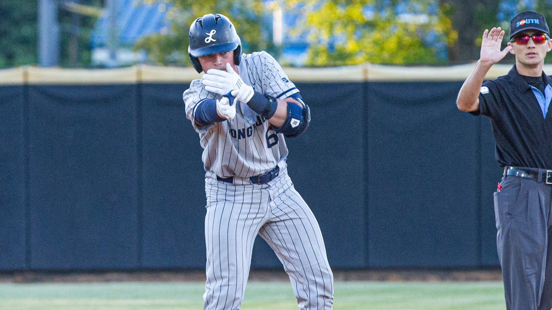 Jack McMullan celebrates after hitting a double