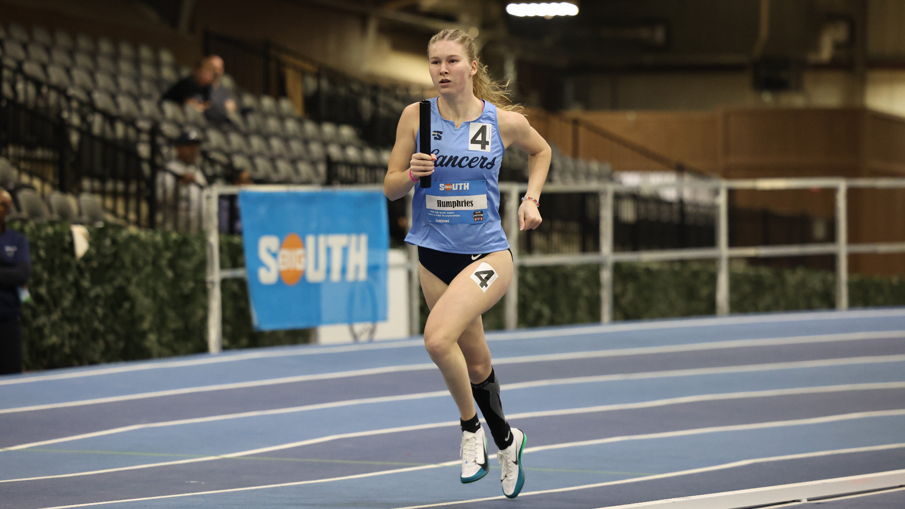 Riley Humphries runs for Longwood track