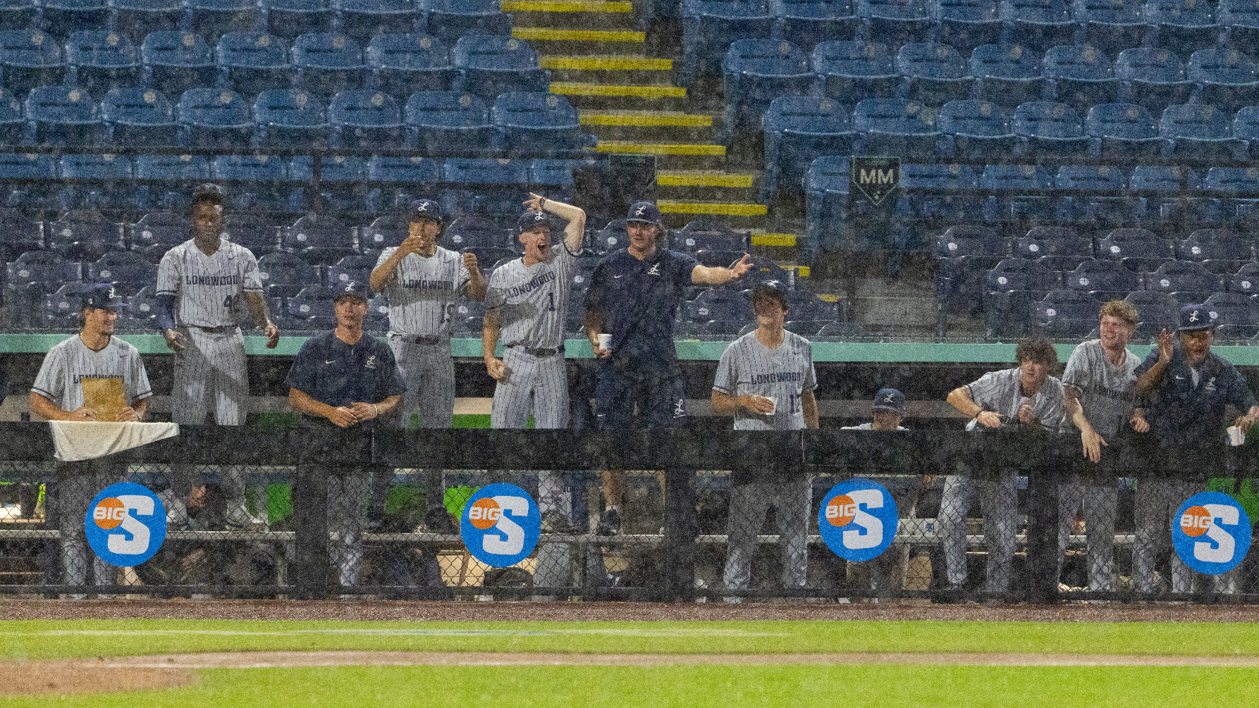 Longwood's dugout celebrates in the rain