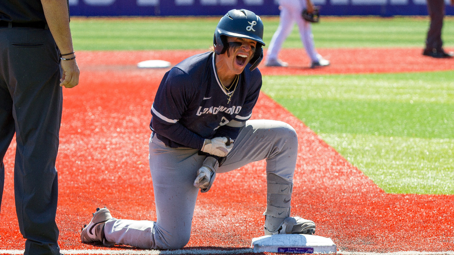 Bentley Yeatts yells after hitting a two-run triple to give Longwood the lead