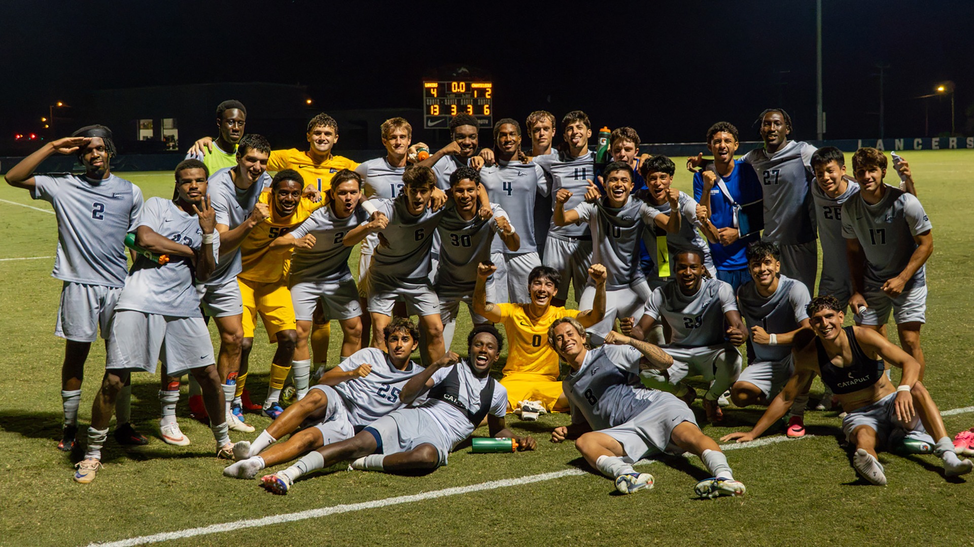 Longwood men's soccer poses for a team photo after celebrating a 4-2 home win over Coastal Carolina. 
