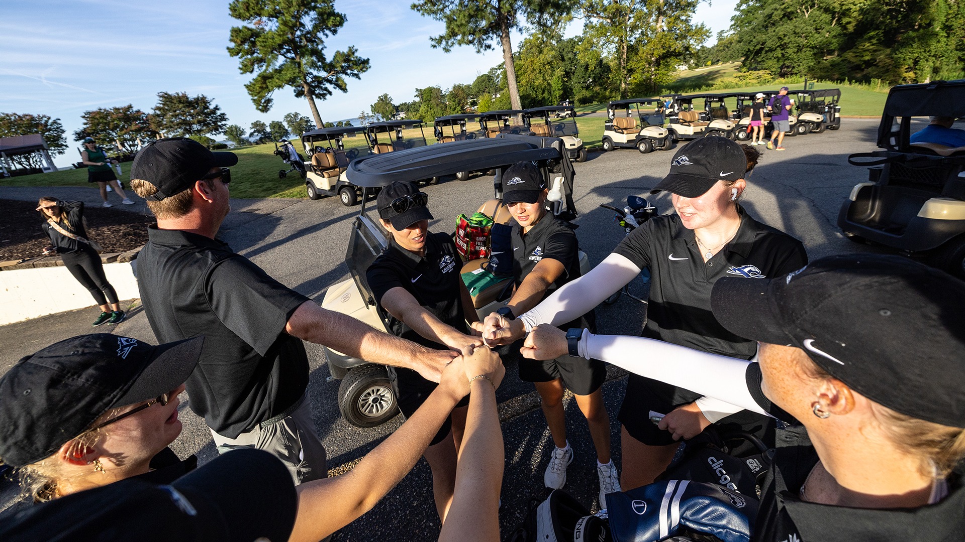 Longwood women's golf huddles up with their hands in the middle ahead of the final round at the Tribe Invitational at the Kingsmill River Course on Sept. 8, 2026.