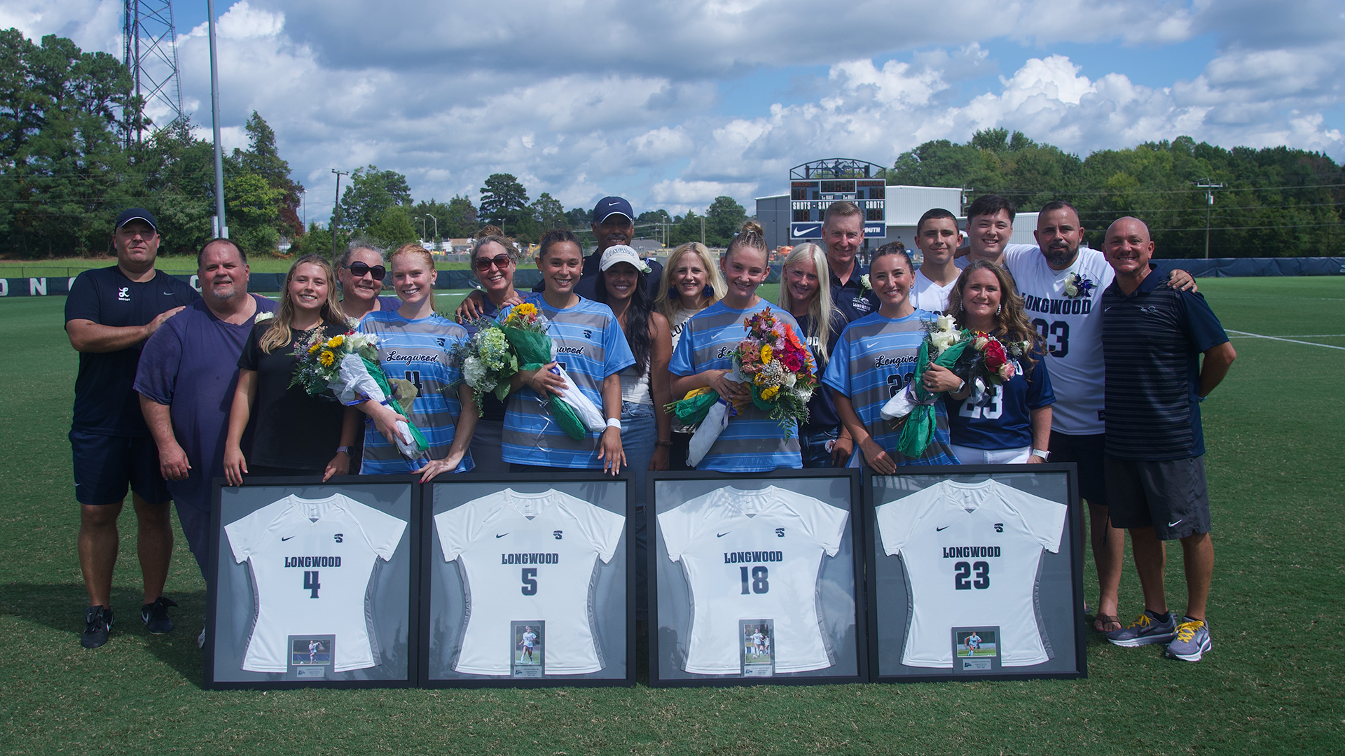 Seniors Madison Fitzpatrick, Cory Silberstein, Peyton Curney and Meghan Piazza pose with coaches, friends and family prior to the game on their senior day on September 13, 2026