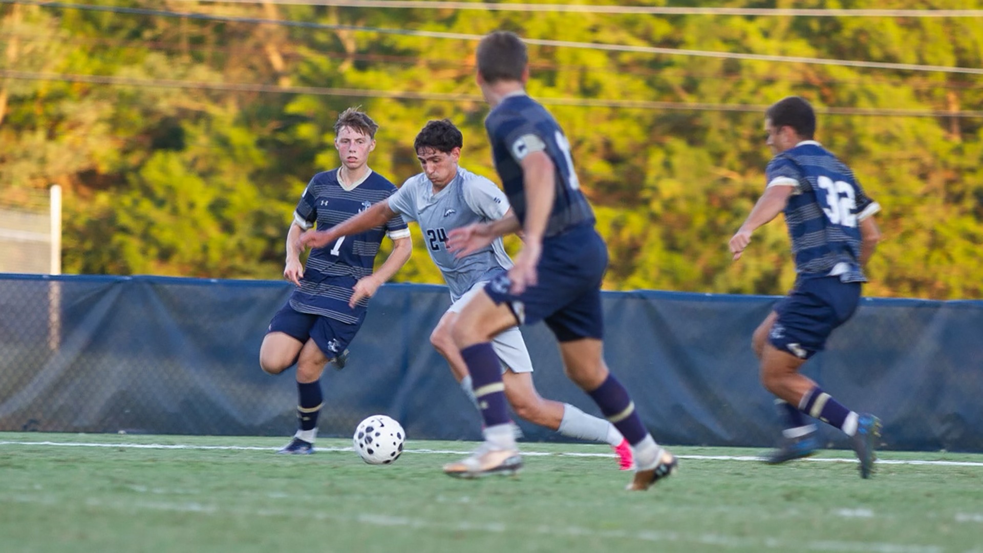 Benjamin Ferrero splits a pair of Navy defenders with his dribble through the midfield in the opening half against the Midshipmen on Sept. 15, 2026 at Longwood Athletics Complex.