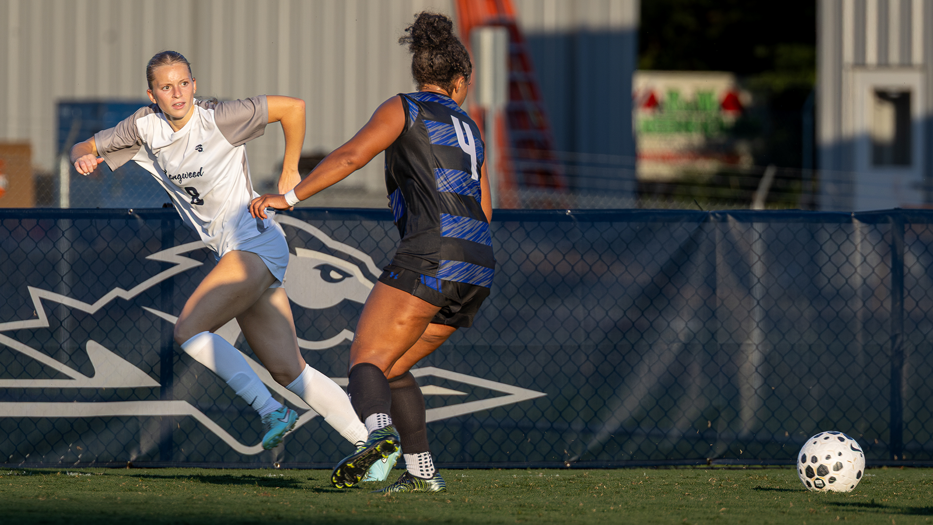 Reese Coggeshall plays a ball past a defender in a match against Hampton on September 6, 2026