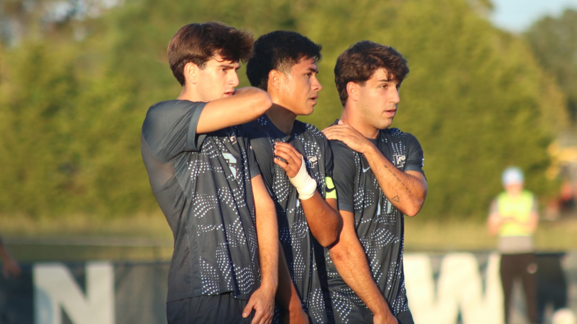 Pau Garcia, Brando Bedolla, and Vicent Martinez stand arm and arm to block a free kick during Longwood's 2-0 home win over USC Upstate on Sept. 26, 2026. 