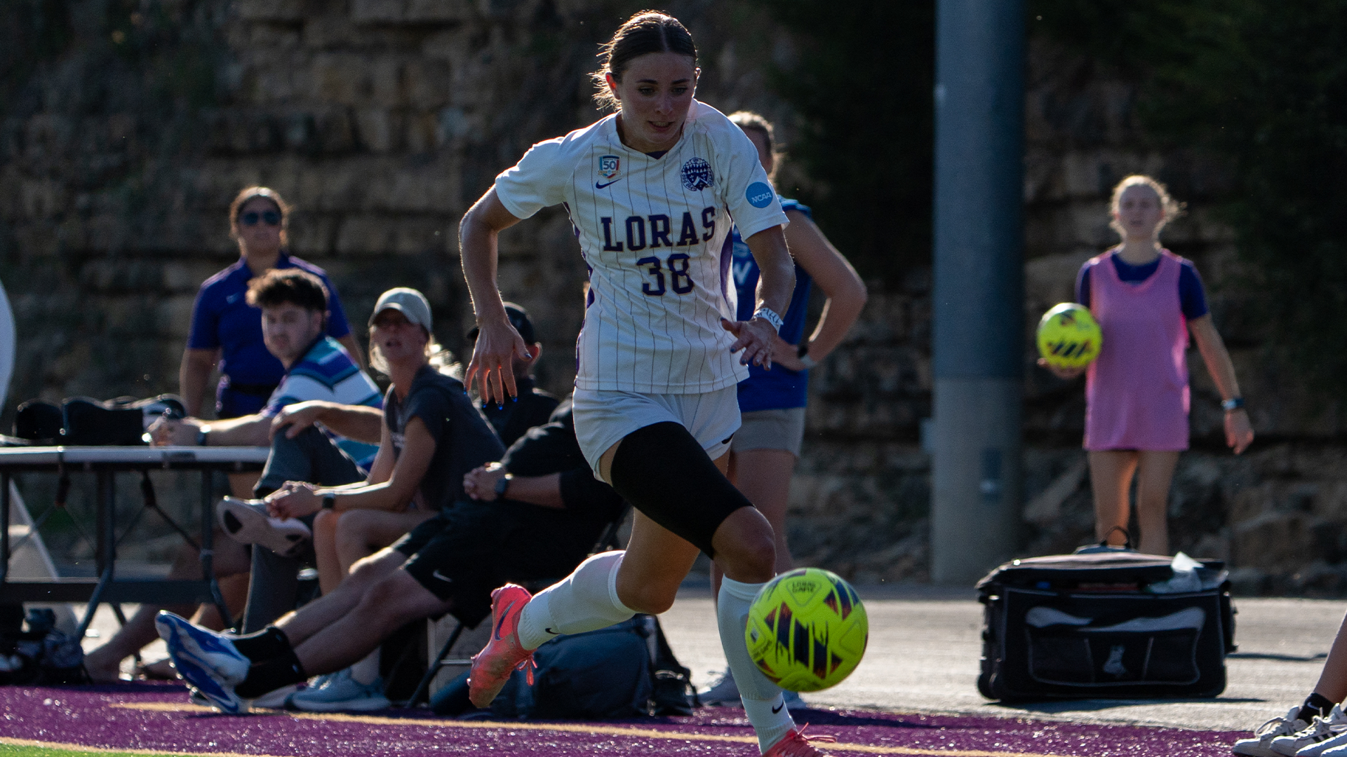 Emily Bowe Dribbling up the field v. CUW 9-9