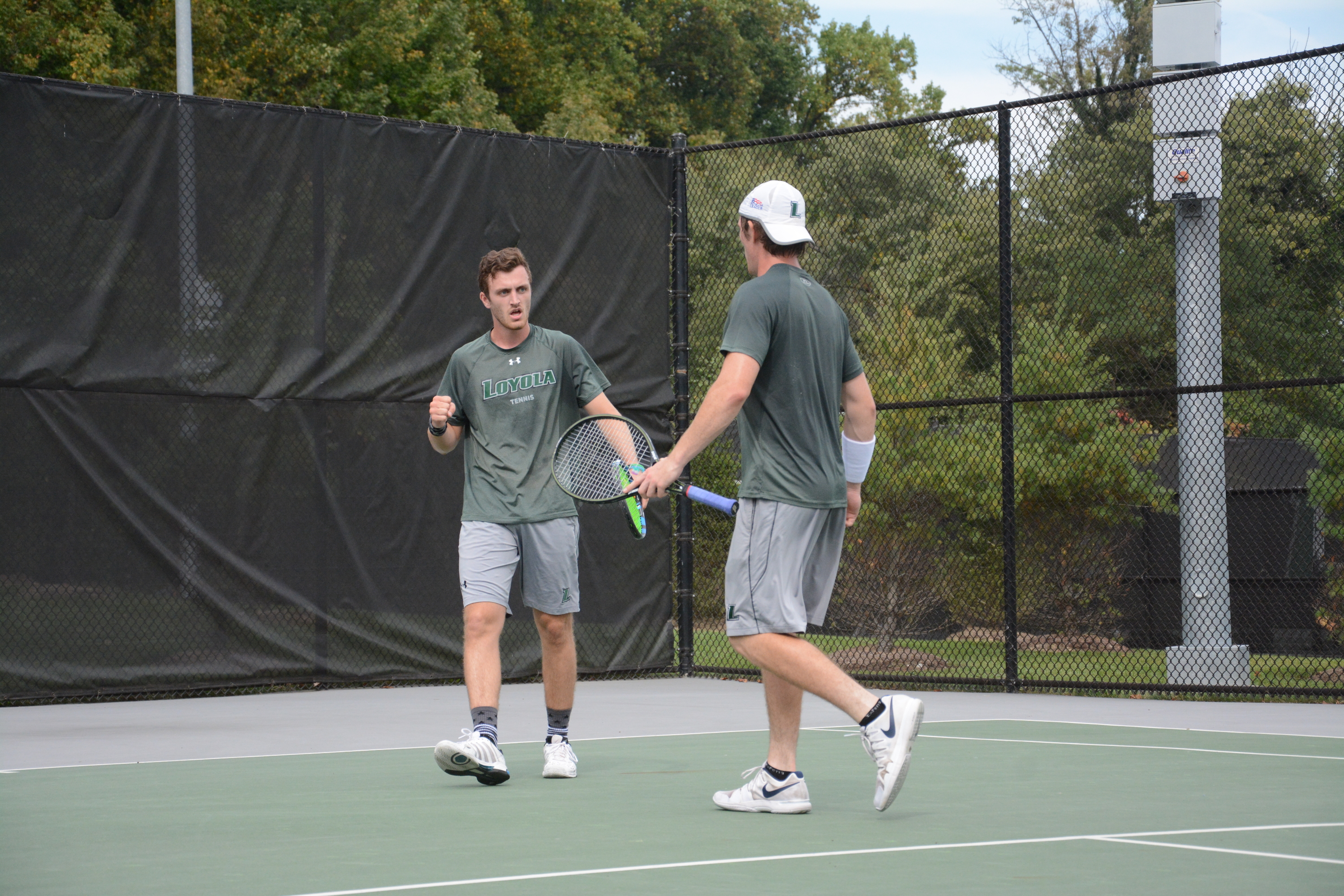 Reid Burch (left) and C.J. Cash celebrate a point.