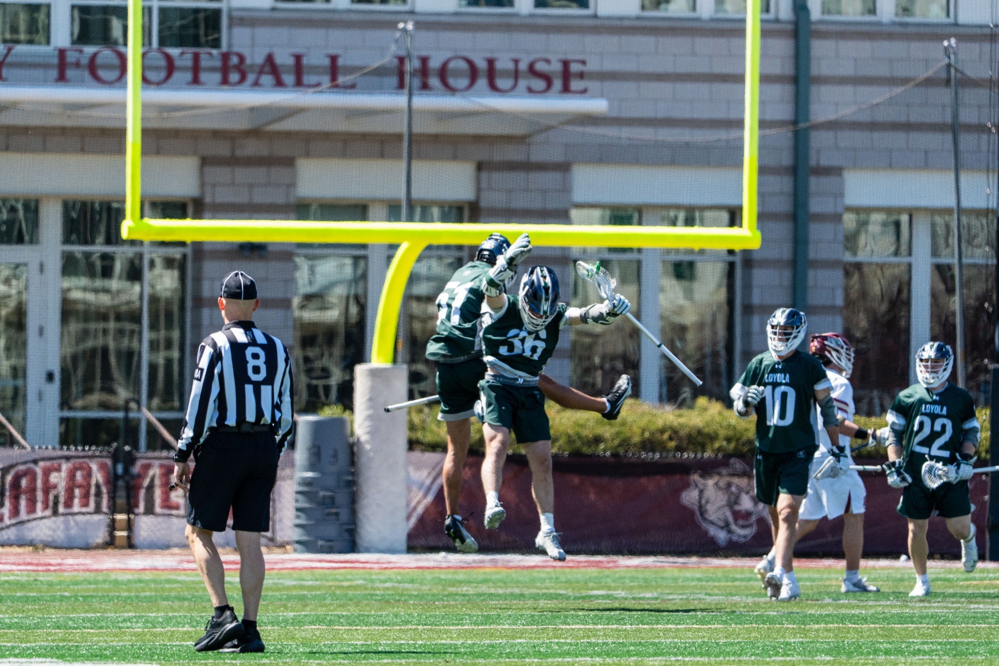 Mason Cook and Connor Wilbur celebrate a Greyhounds goal