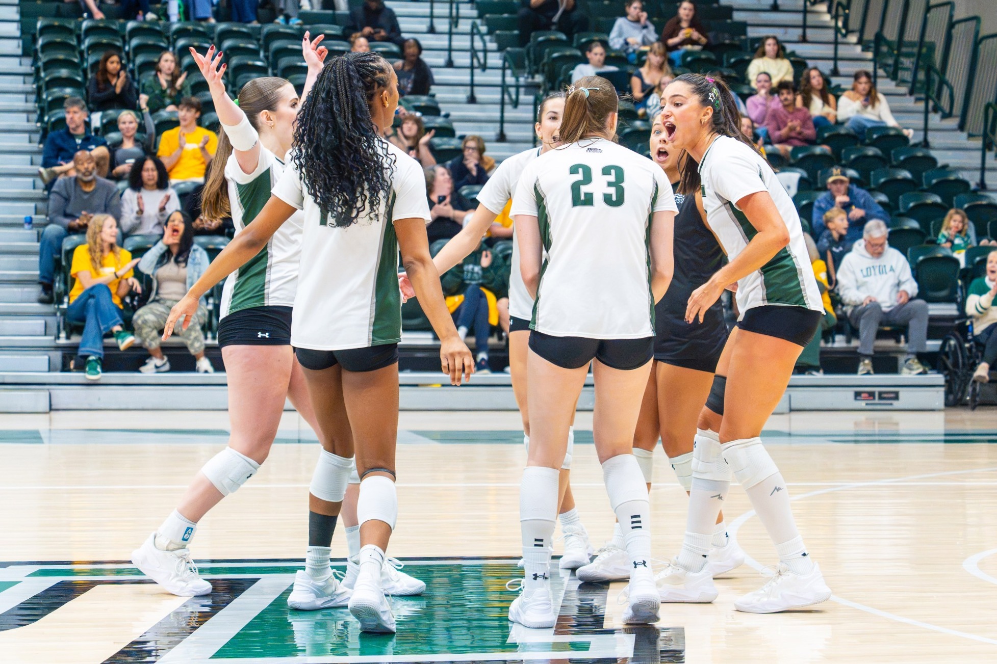 The Greyhounds celebrate a first-set win against Bucknell