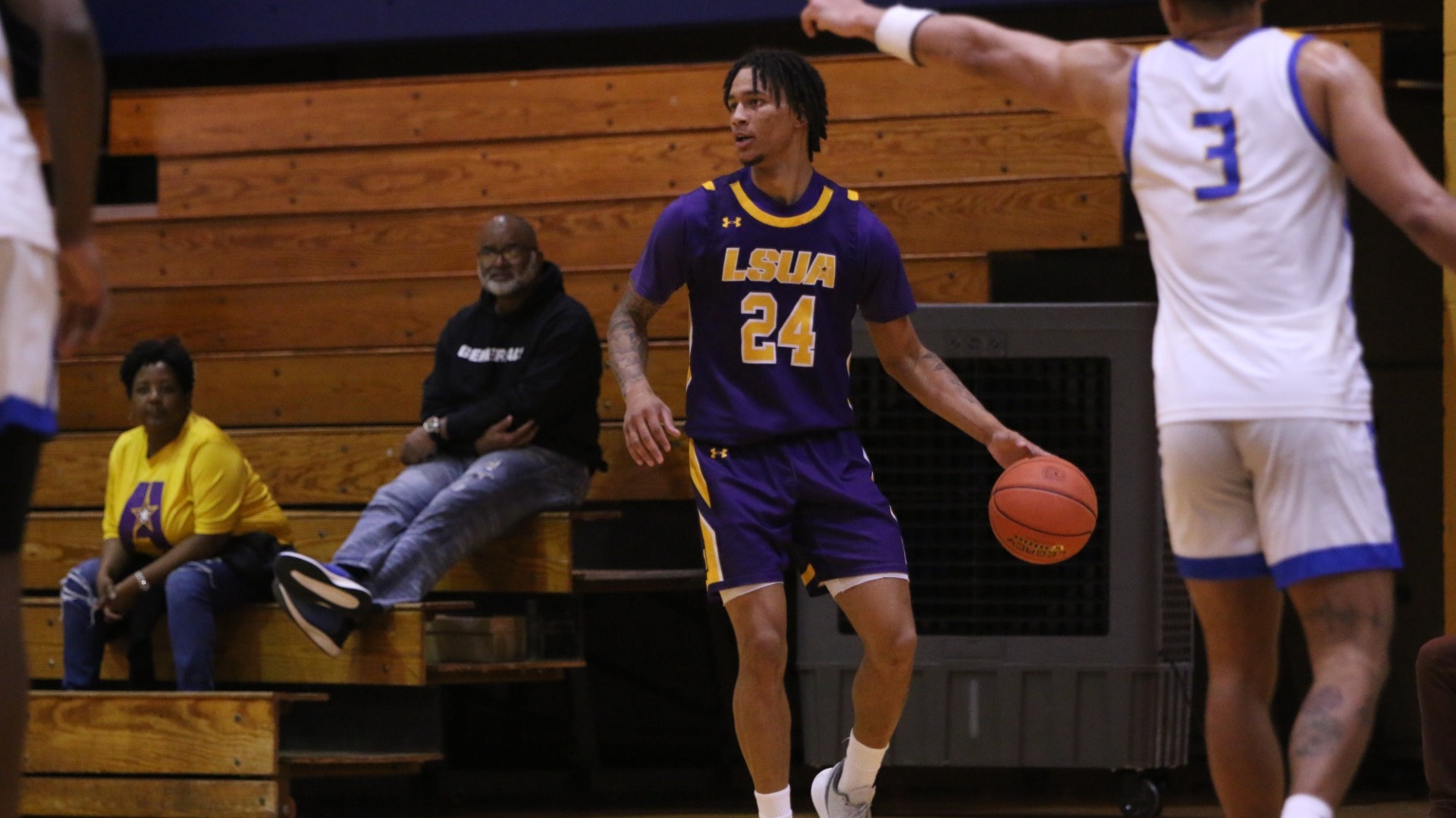 TJ James dribbles against Jarvis Christian