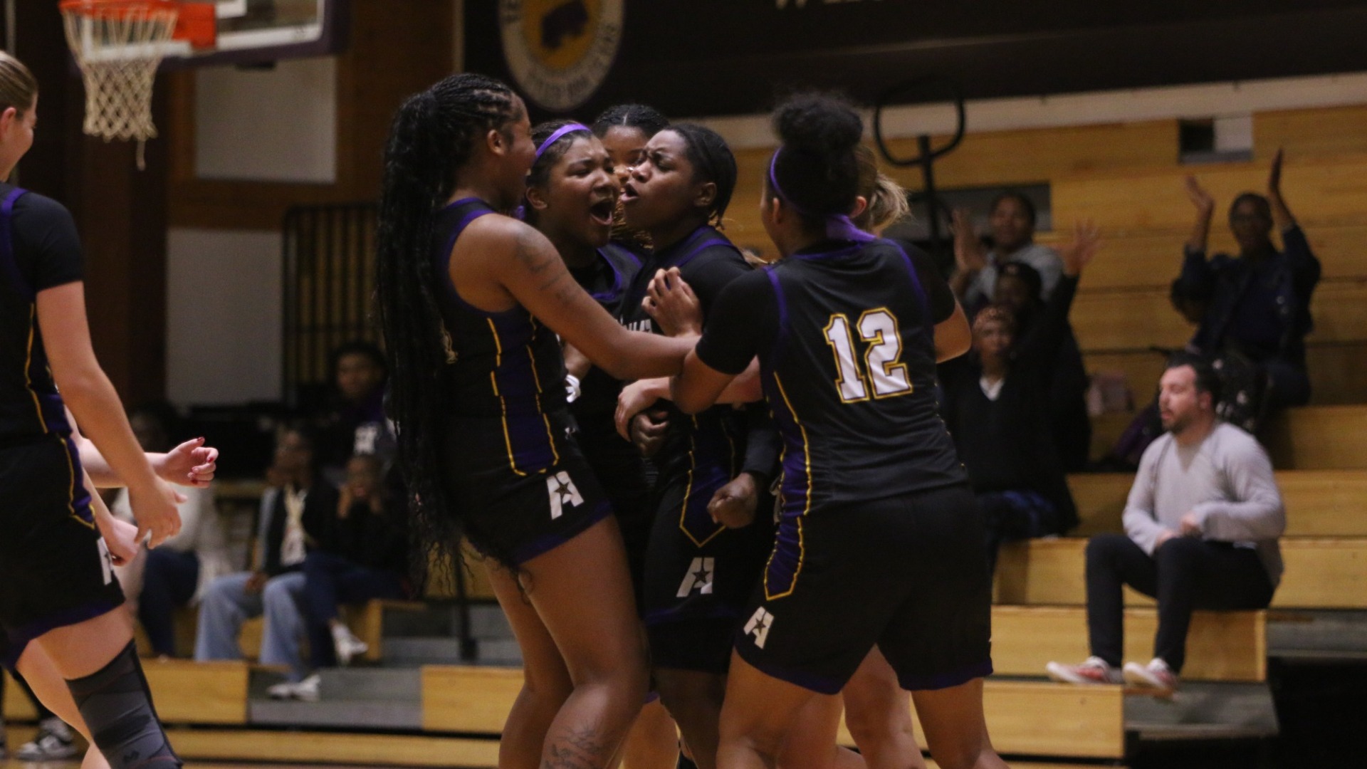 Kaitlyn Blake celebrates after hitting a half-court buzzer beater against Texas College 