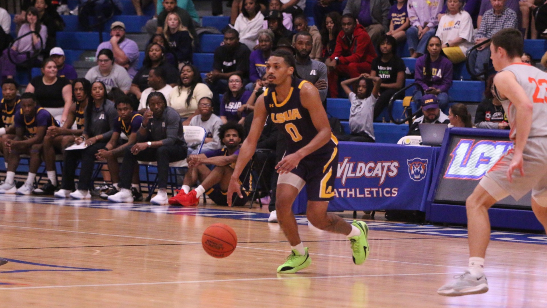 PD McCraney dribbles during a game against LCU