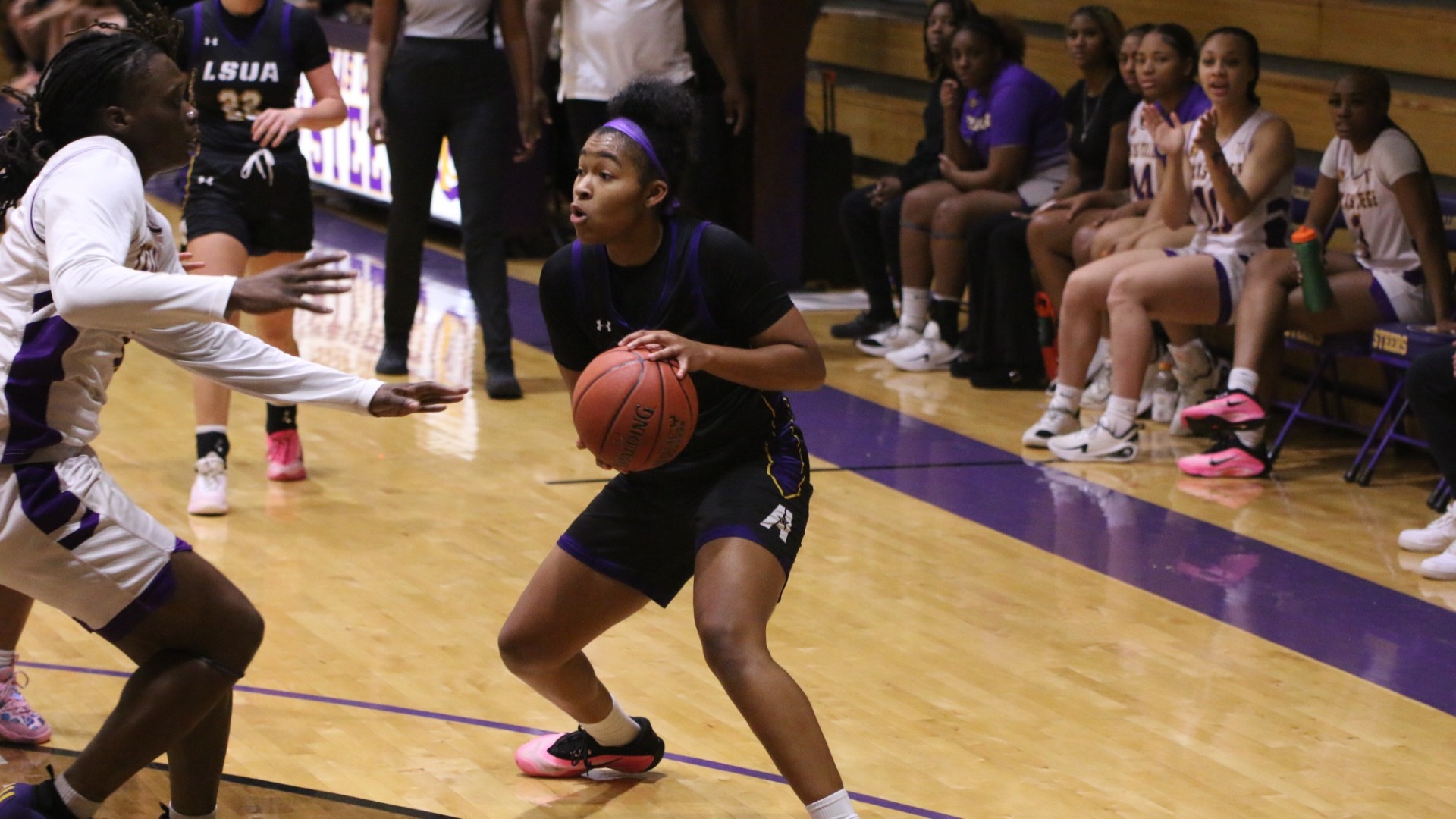 Sydney Person looks to get around a defender against Texas College