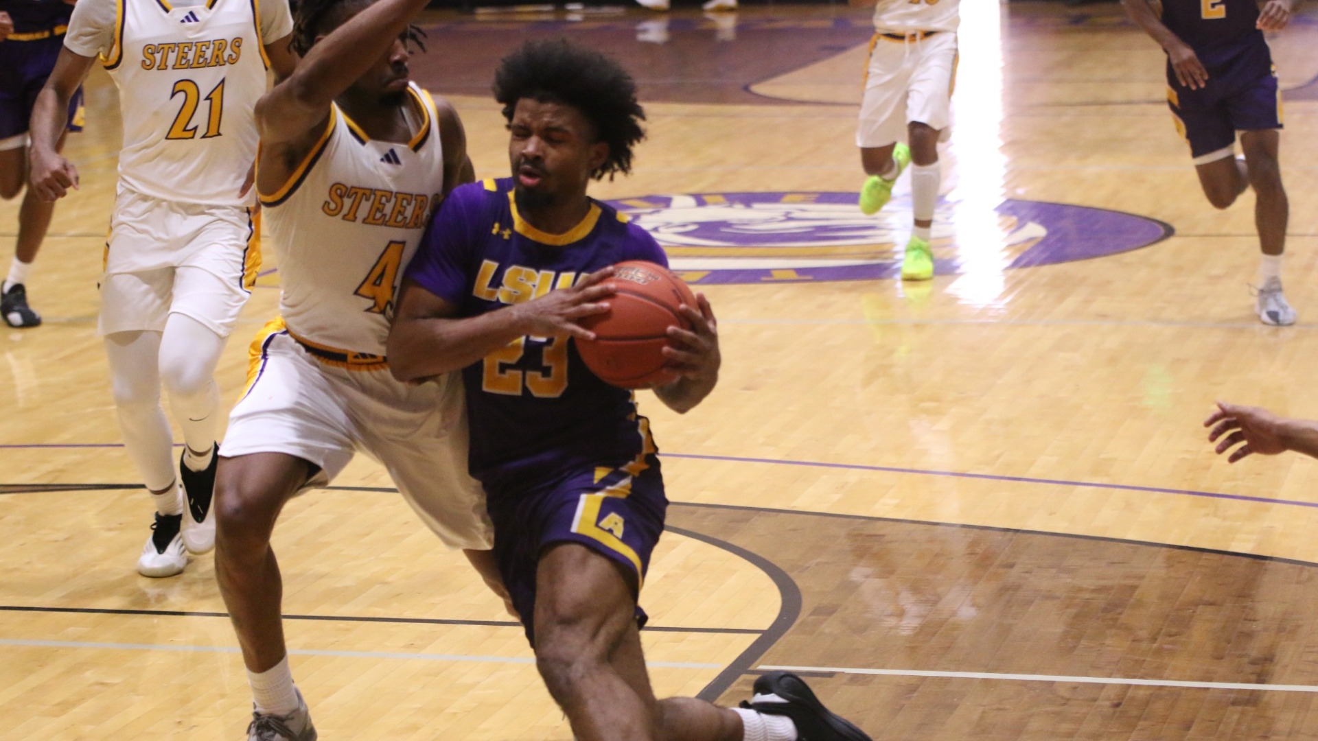 Jordan Decuir goes to the hoop against TC