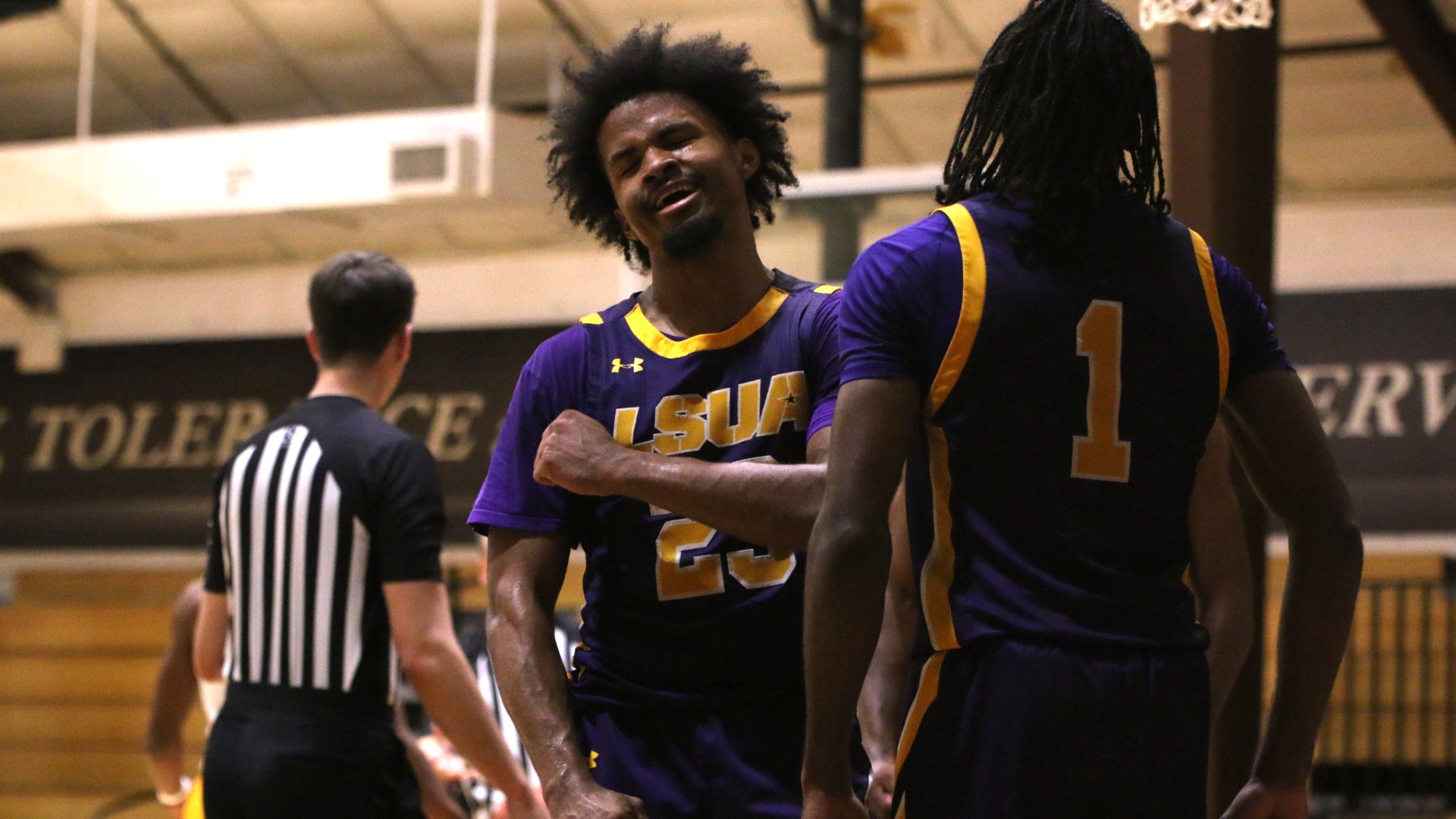 Jordan Decuir and EJ McQuillan celebrate after a basket late in the game against Texas College