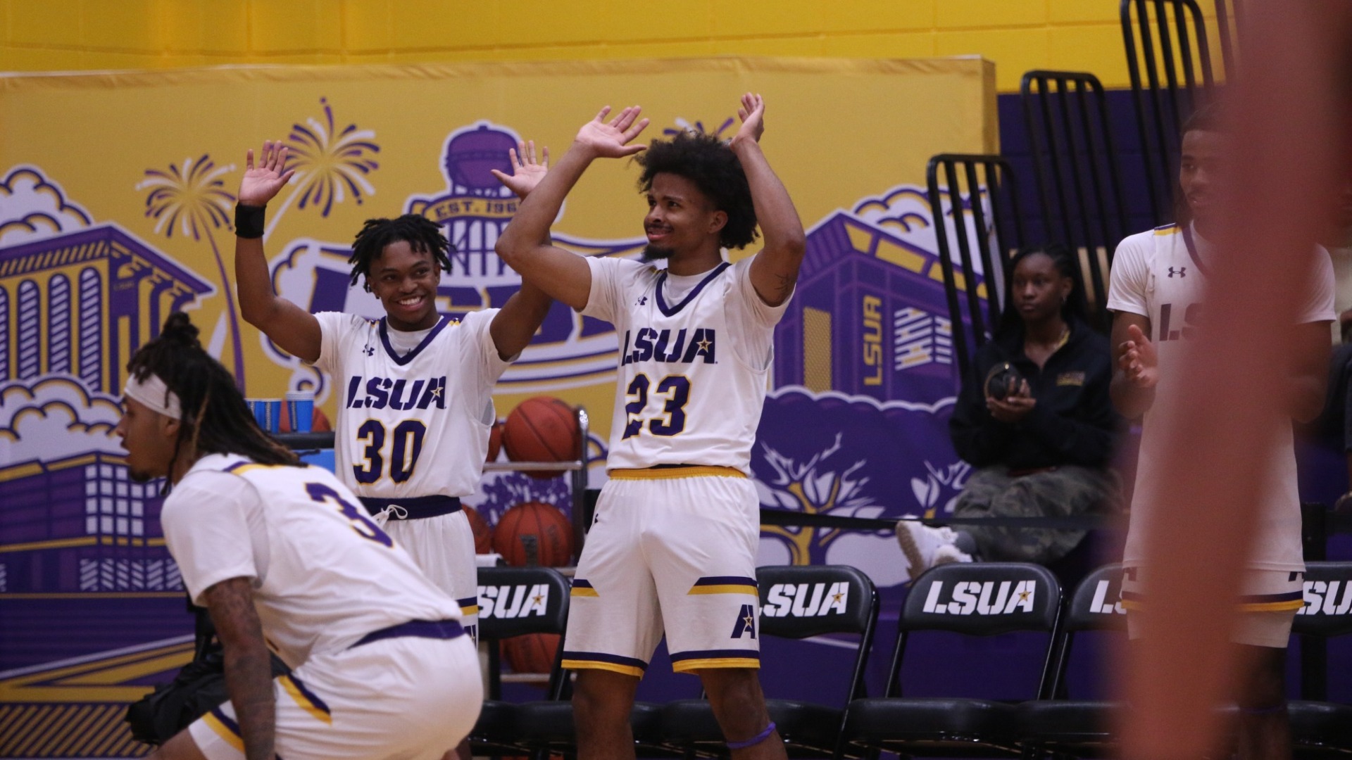Jordan Decuir and Kheiri Haynes celebrate during a game against Southwest