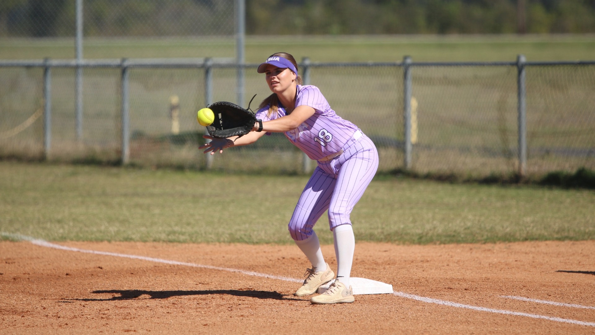 Julia Kwakernaak catches a ball at 1B during a fall game