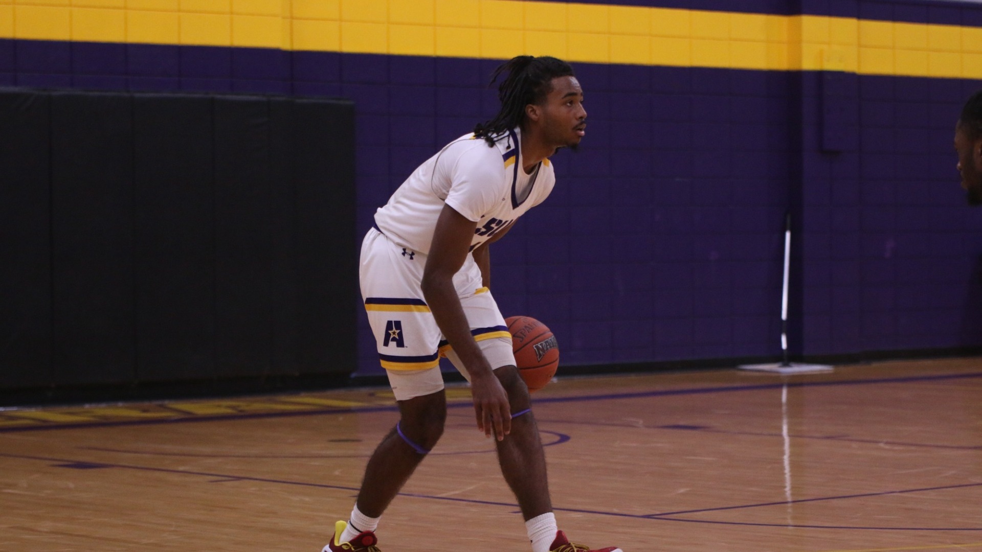 EJ McQuillan dribbles in a game against TAMUT