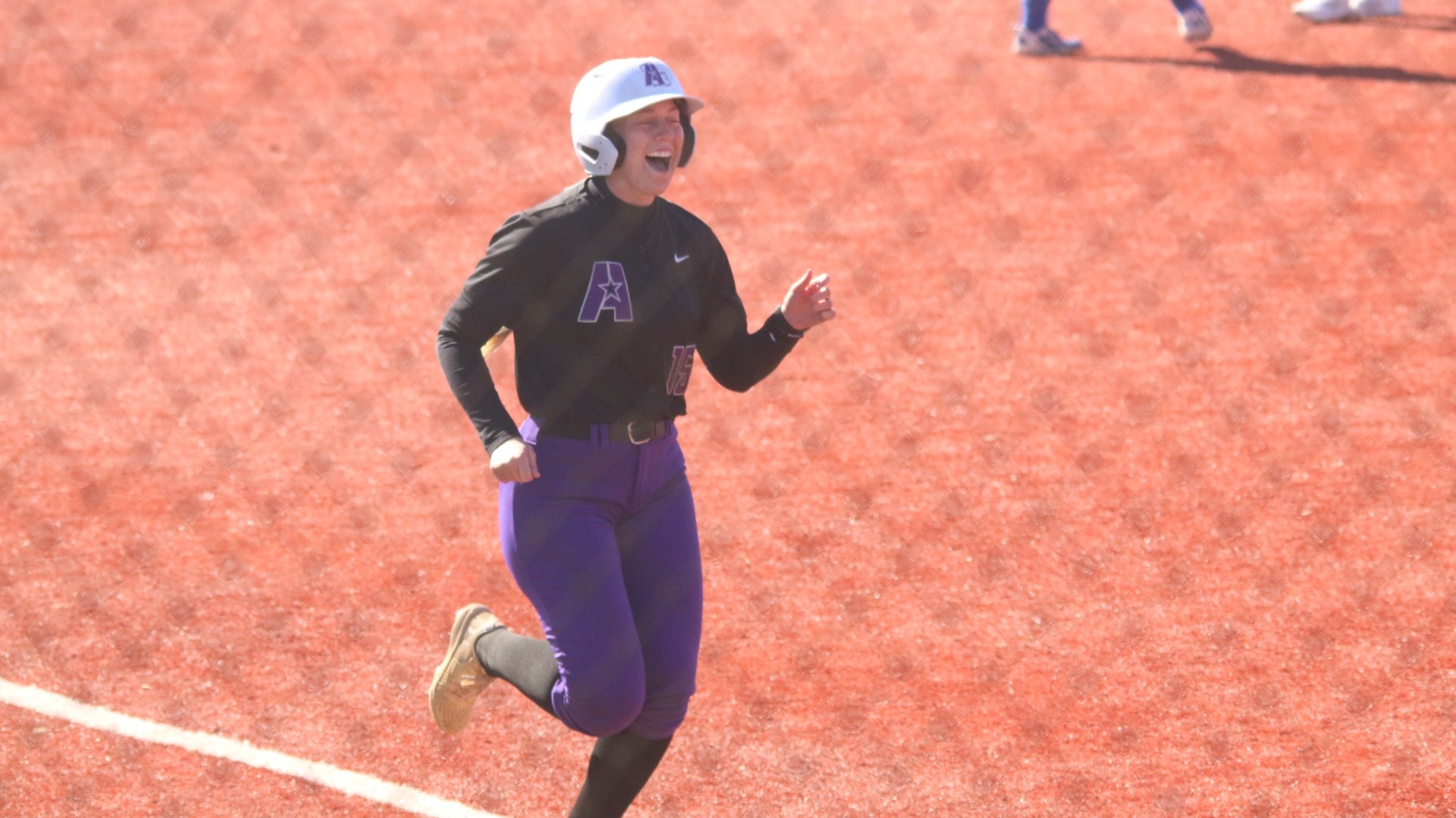 Kaetlyn Dunbar smiles as she completes her home run trot against ERAU