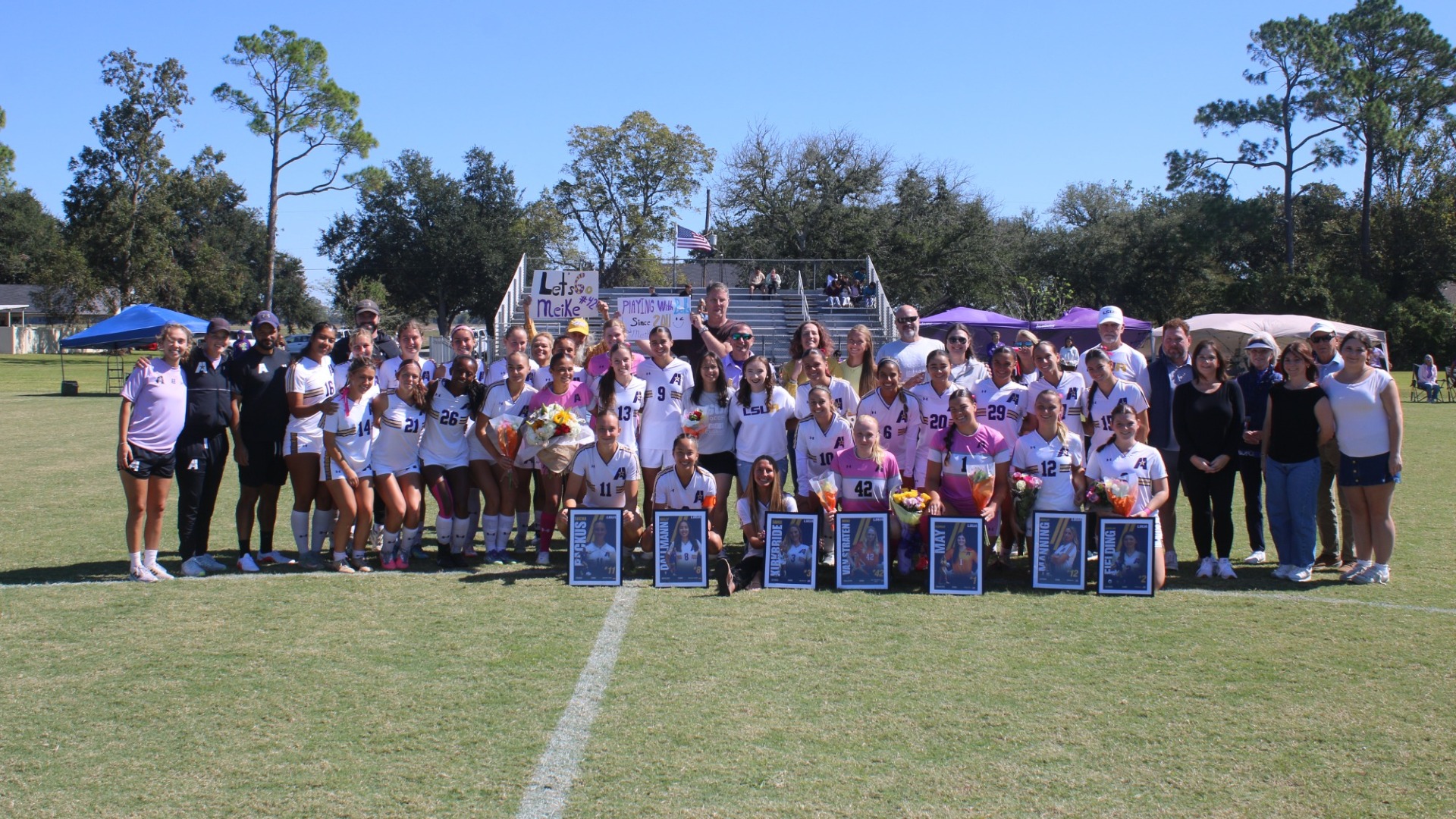 2026 LSUA Women's Soccer seniors pose with family and friends during the senior ceremony