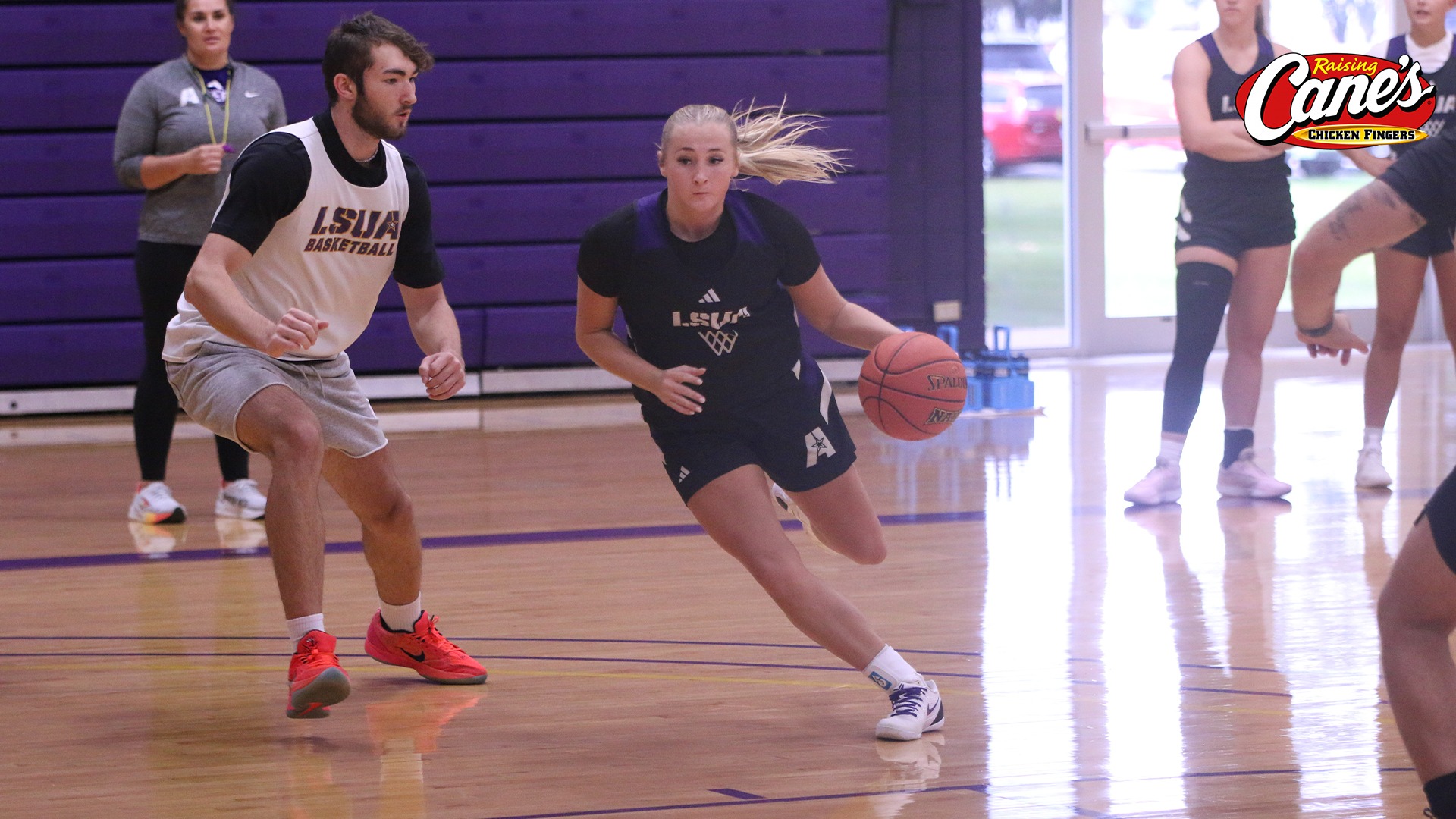 Mollie Miller drives the line against a practice player