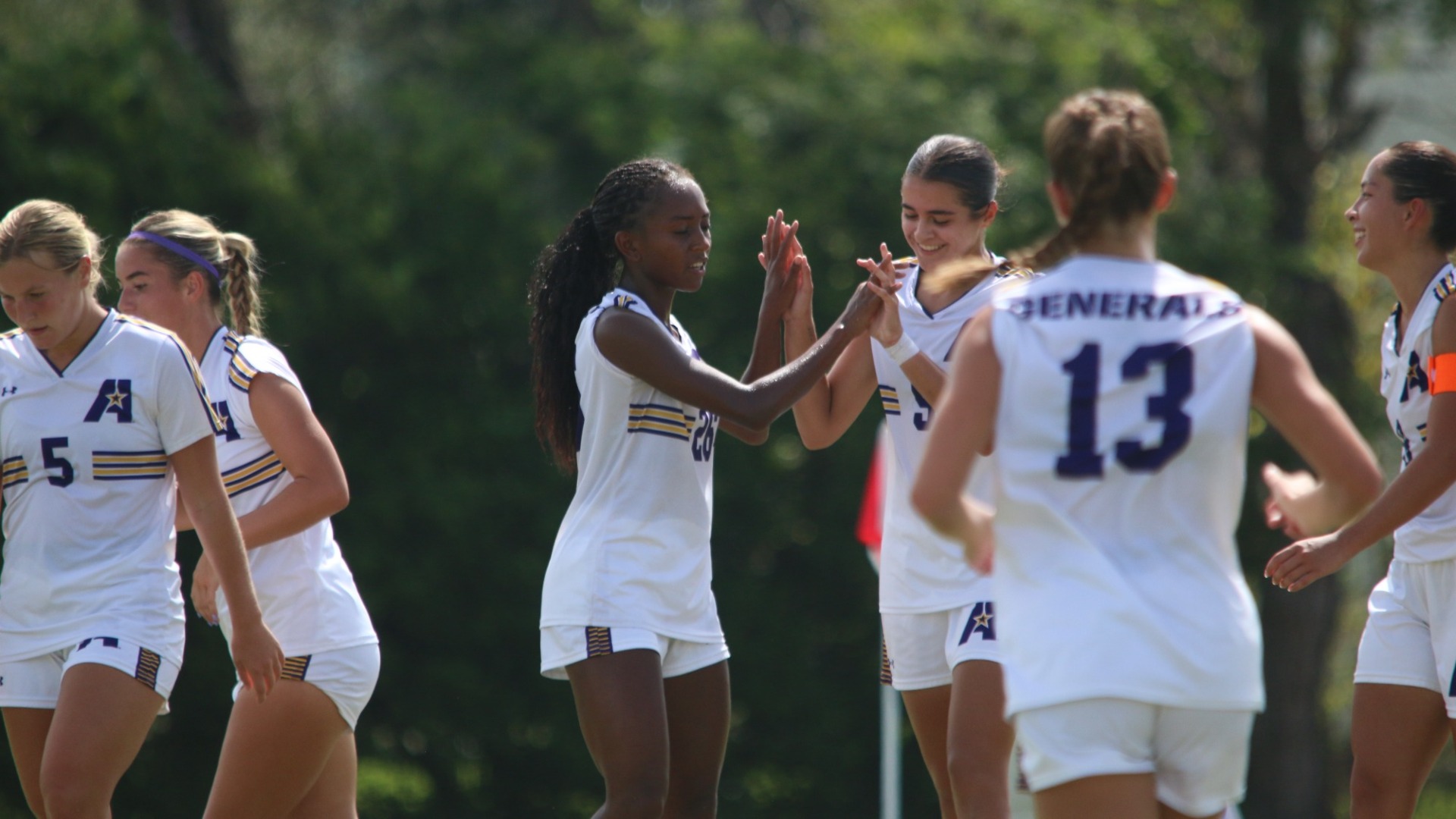 Sara Escribano celebrates with Justice Richardson after scoring
