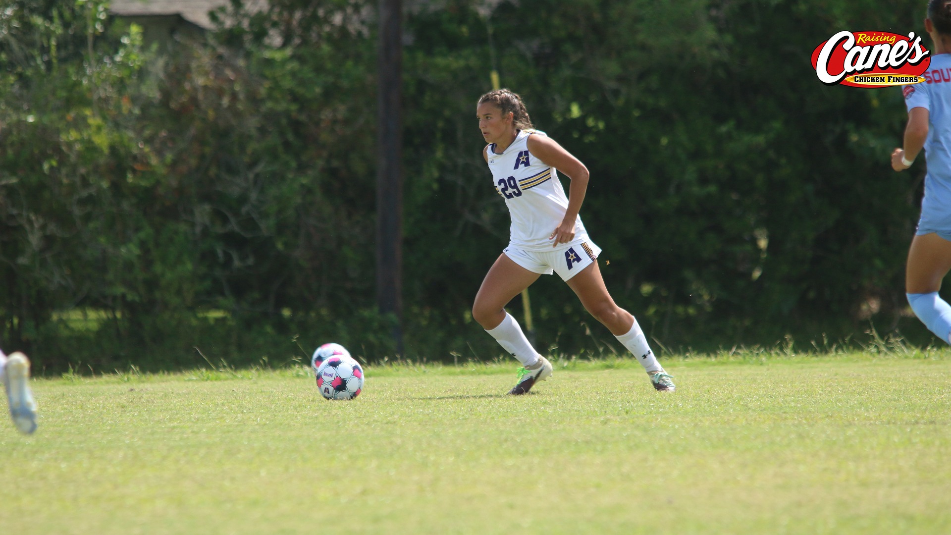 Alley Habetz dribbles up pitch during a game