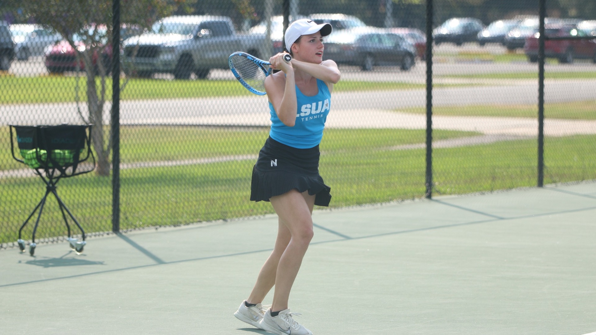 Ekaterina Orlova returns a ball during practice 