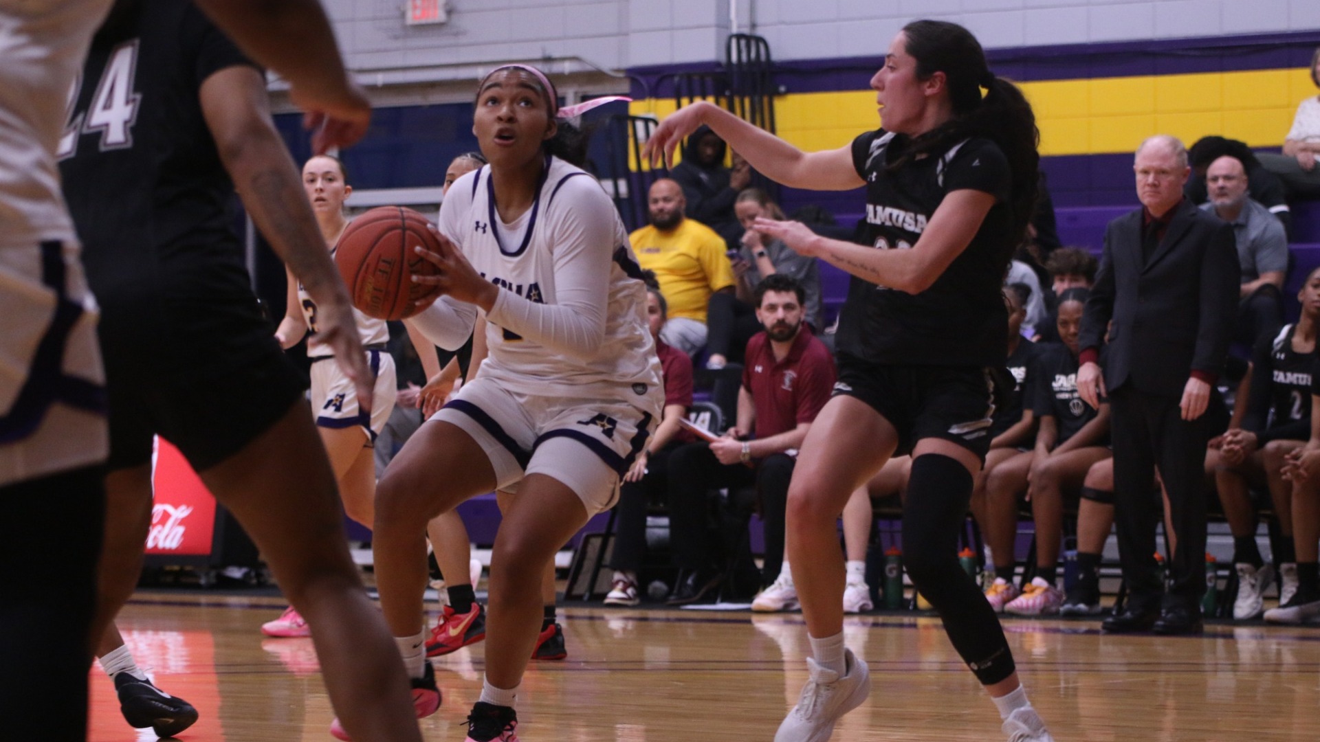 Sydney Person drives the lane against San Antonio