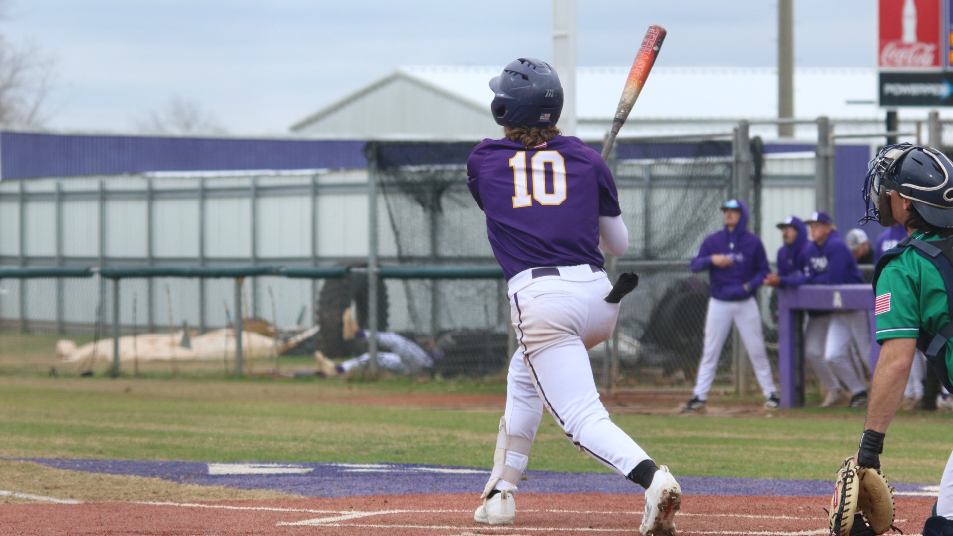 Dalton Wilson watches a ball he hit during a game against JMU