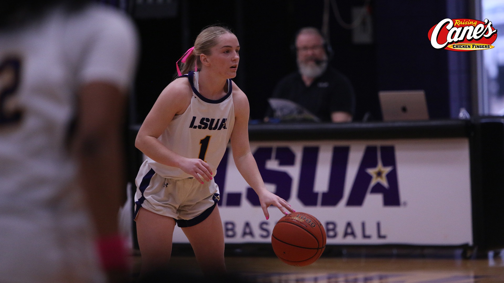 Reese Stephens dribbles near half-court during a game against Our Lady of the Lake