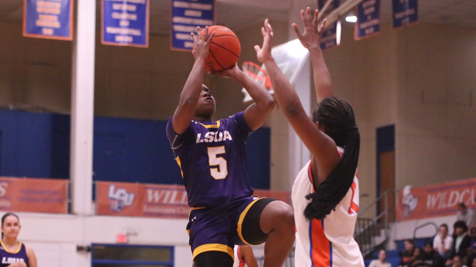 Kaitlyn Blake shoots over a defender in a game against LCU
