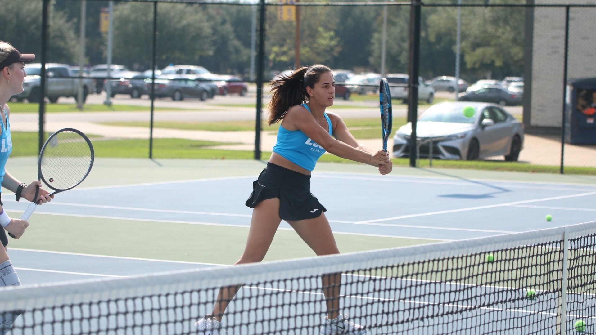 Nahia Echaide returns a ball at the net during practice