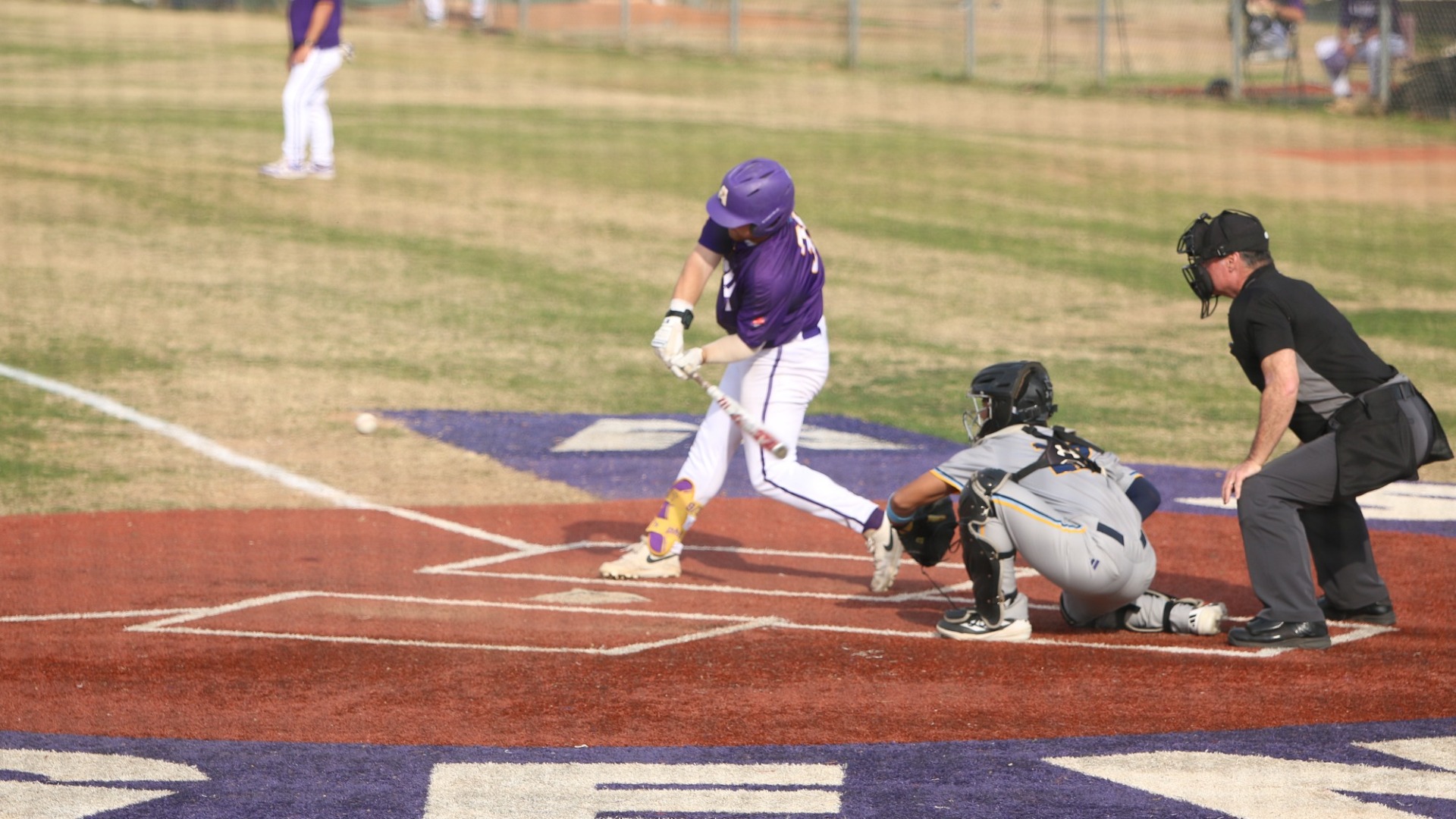 Fischer Einkauf swings at a pitch during a game against SUNO