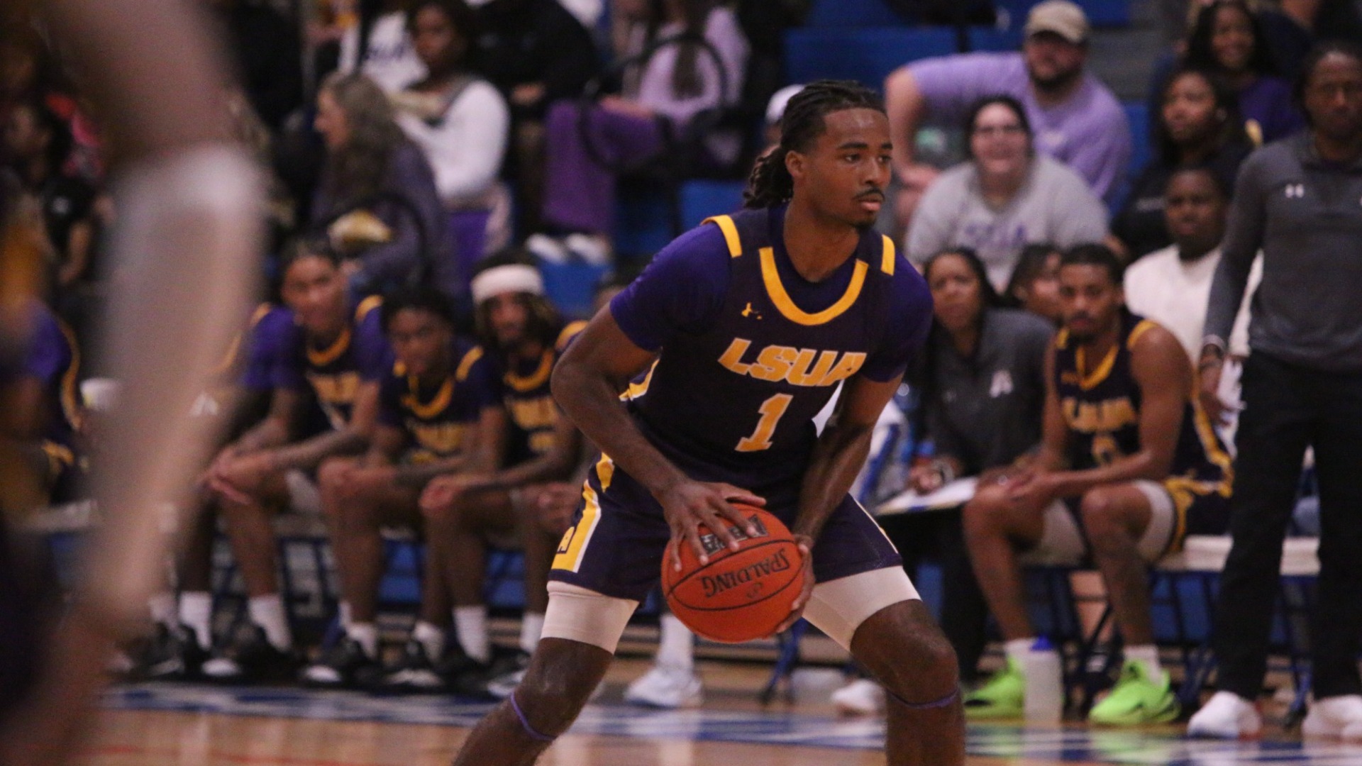 EJ McQuillan holds the ball during a game at LCU