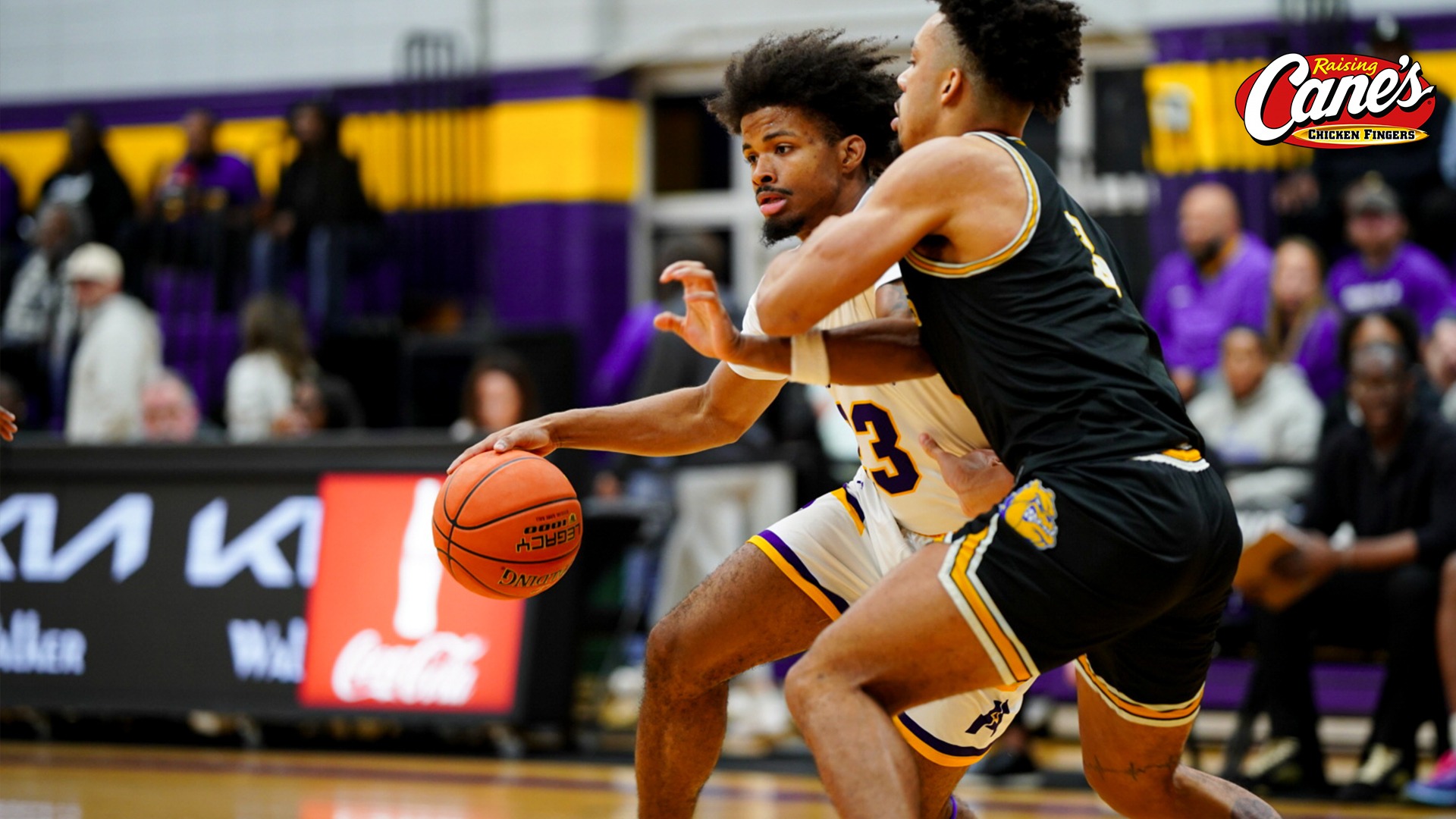 Jordan Decuir dribbles around a defender against Jarvis Christian